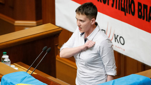 Ukrainian pilot and MP Nadiya Savchenko sings the national anthem as she attends her first session in the parliament after being freed from confinement in Russia as part of a prisoner swap in Kiev, Ukraine, May 31, 2016. REUTERS/Gleb Garanich