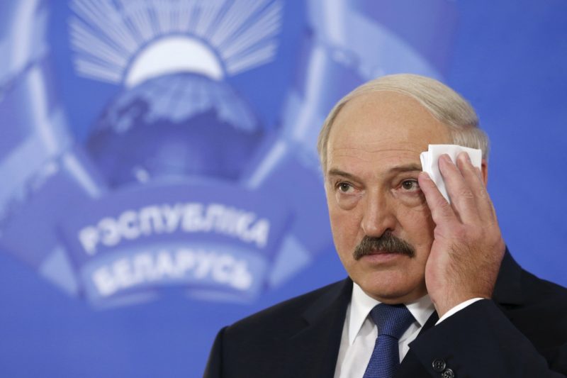Belarus' President Alexander Lukashenko wipes his face at a news conference during a presidential election in Minsk, Belarus, October 11, 2015. Belarussians head to the polls on Sunday to cast their vote in presidential elections all but certain to re-elect authoritarian incumbent Alexander Lukashenko for a fifth term. REUTERS/Vasily Fedosenko