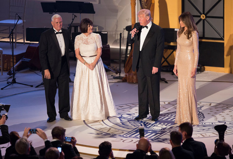 WASHINGTON, DC - JANUARY 19: Vice President-elect Mike Pence (L), his wife Karen Pence (2nd L) and Melania Trump listen to President-elect Donald J. Trump speak at the Indiana Society Ball to thank donors January 19, 2017 in Washington, DC. (Photo by Chris Kleponis-Pool/Getty Images)